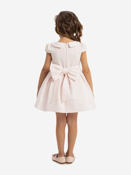 Back view pink baby dress with bow waist detail and short flutter sleeves