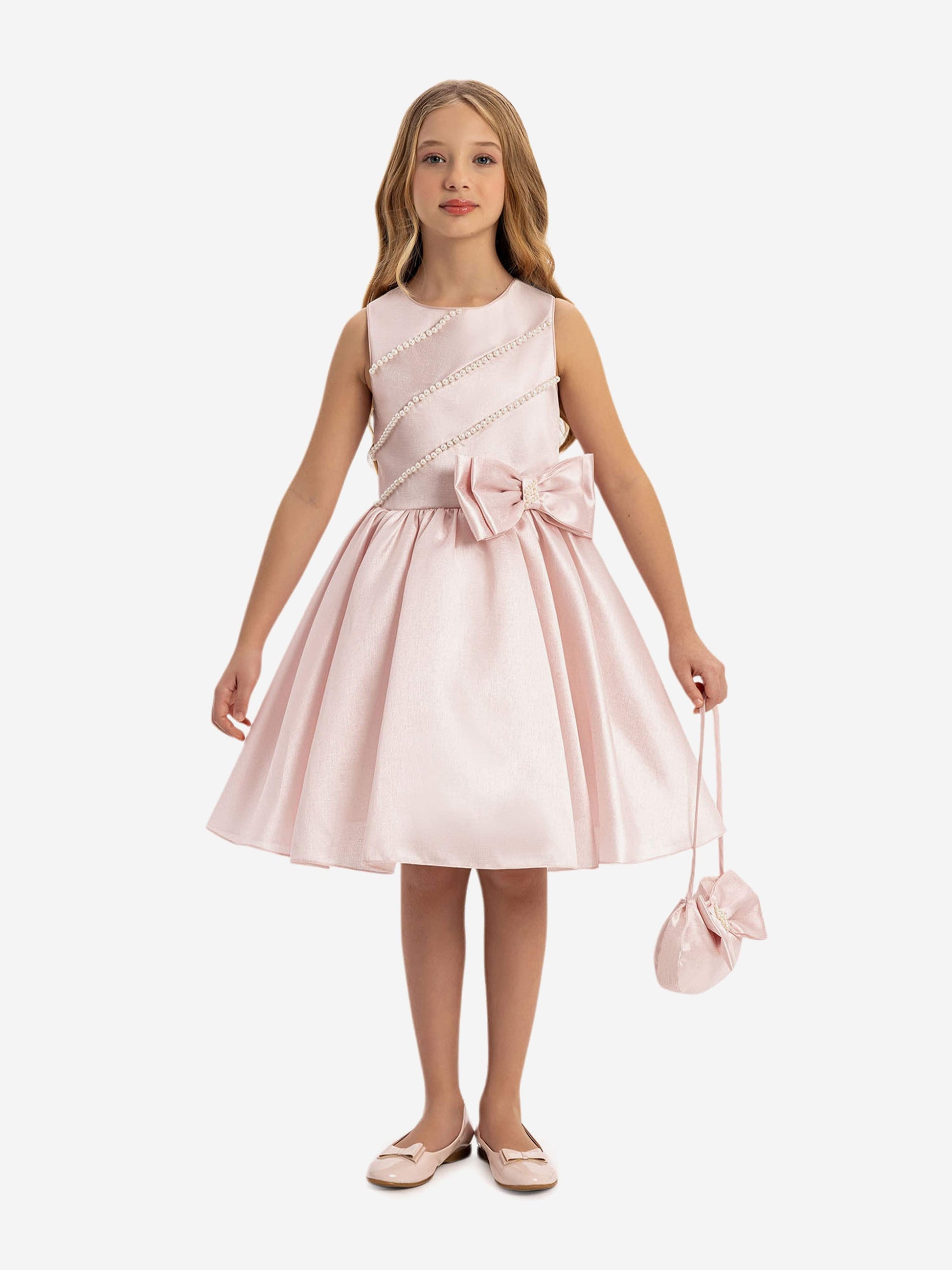 Girls pink satin dress with pearl trim, bow waist, and matching mini bag
