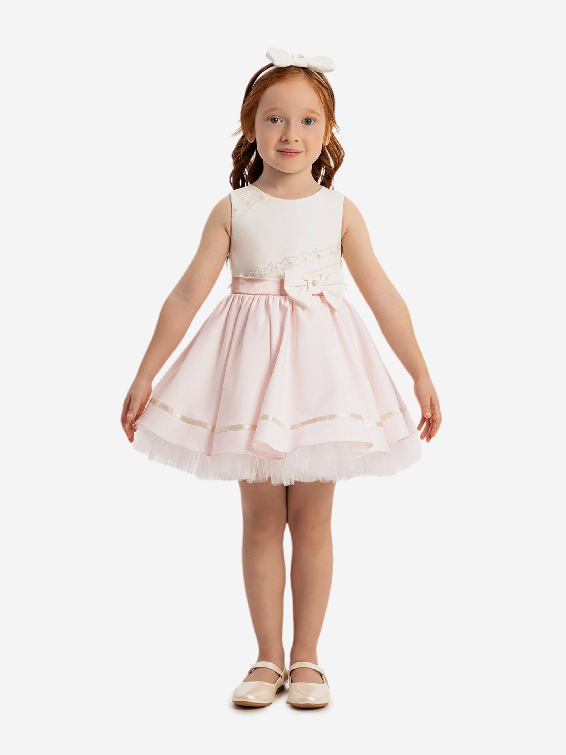 Pink baby girls dress with white lace bodice, tulle skirt and bow detail