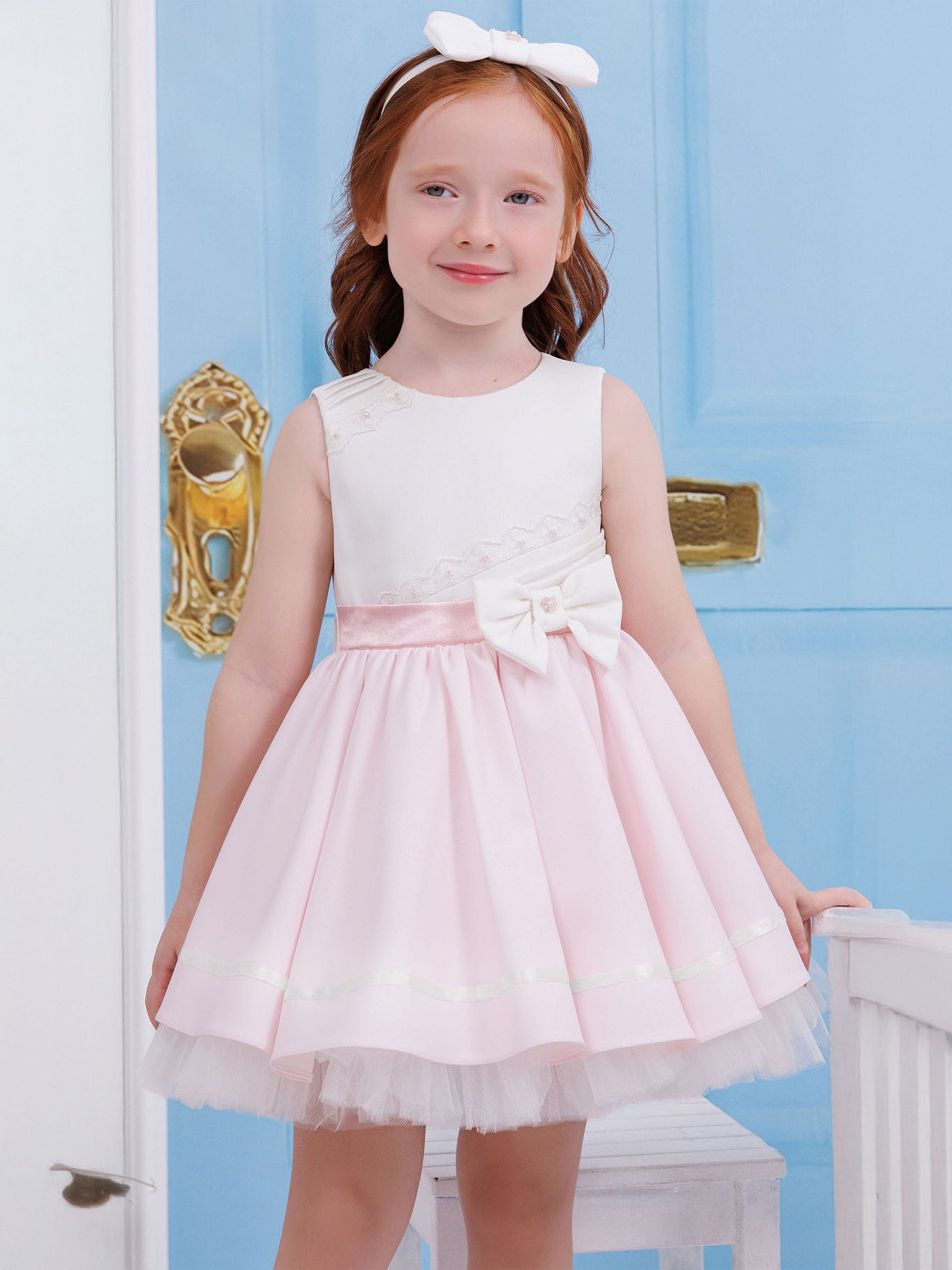 Pink twirl dress with lace trim, satin bow belt and white headband