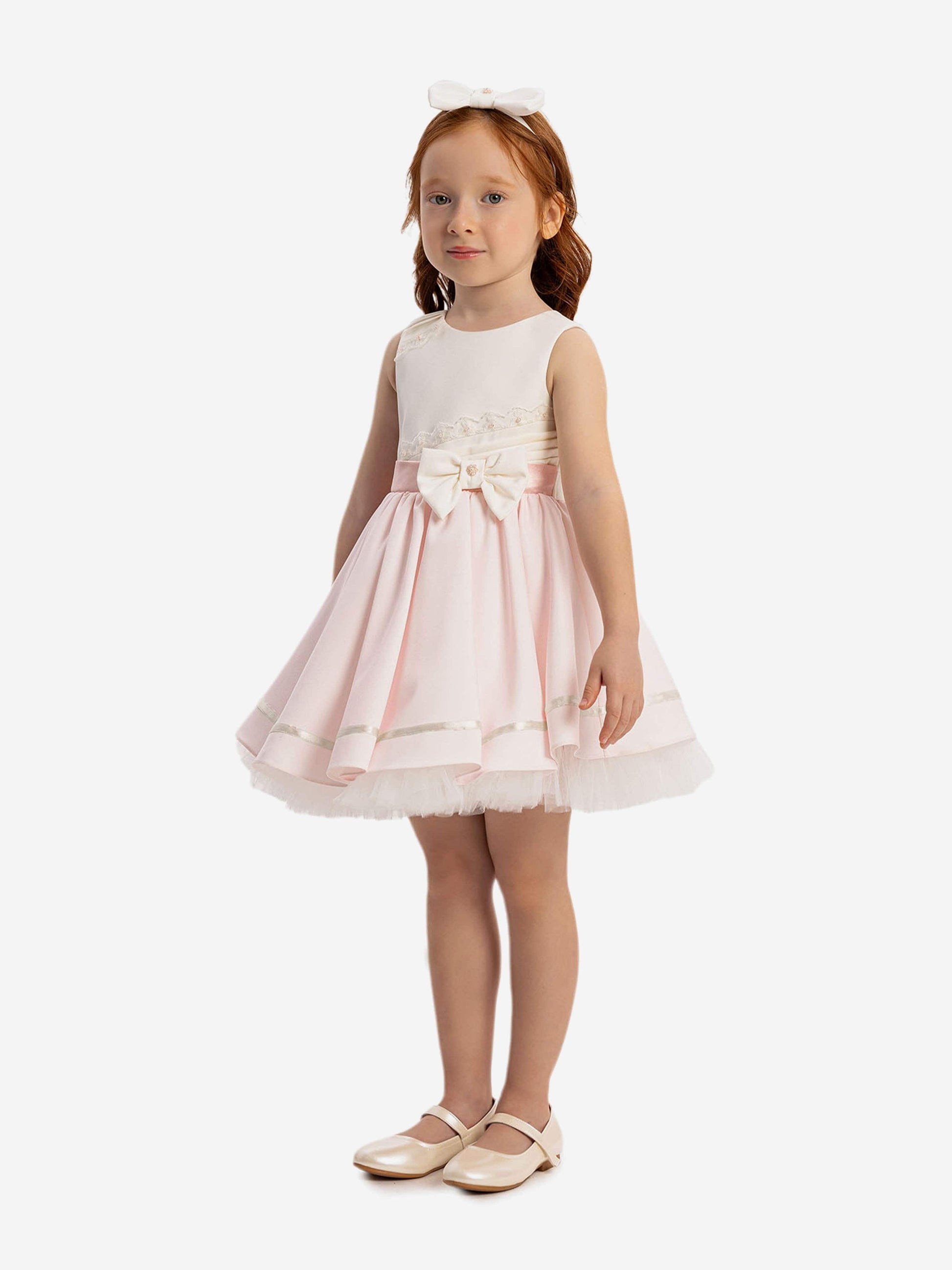 Pink twirl dress with lace bodice, satin bow waist and white headband
