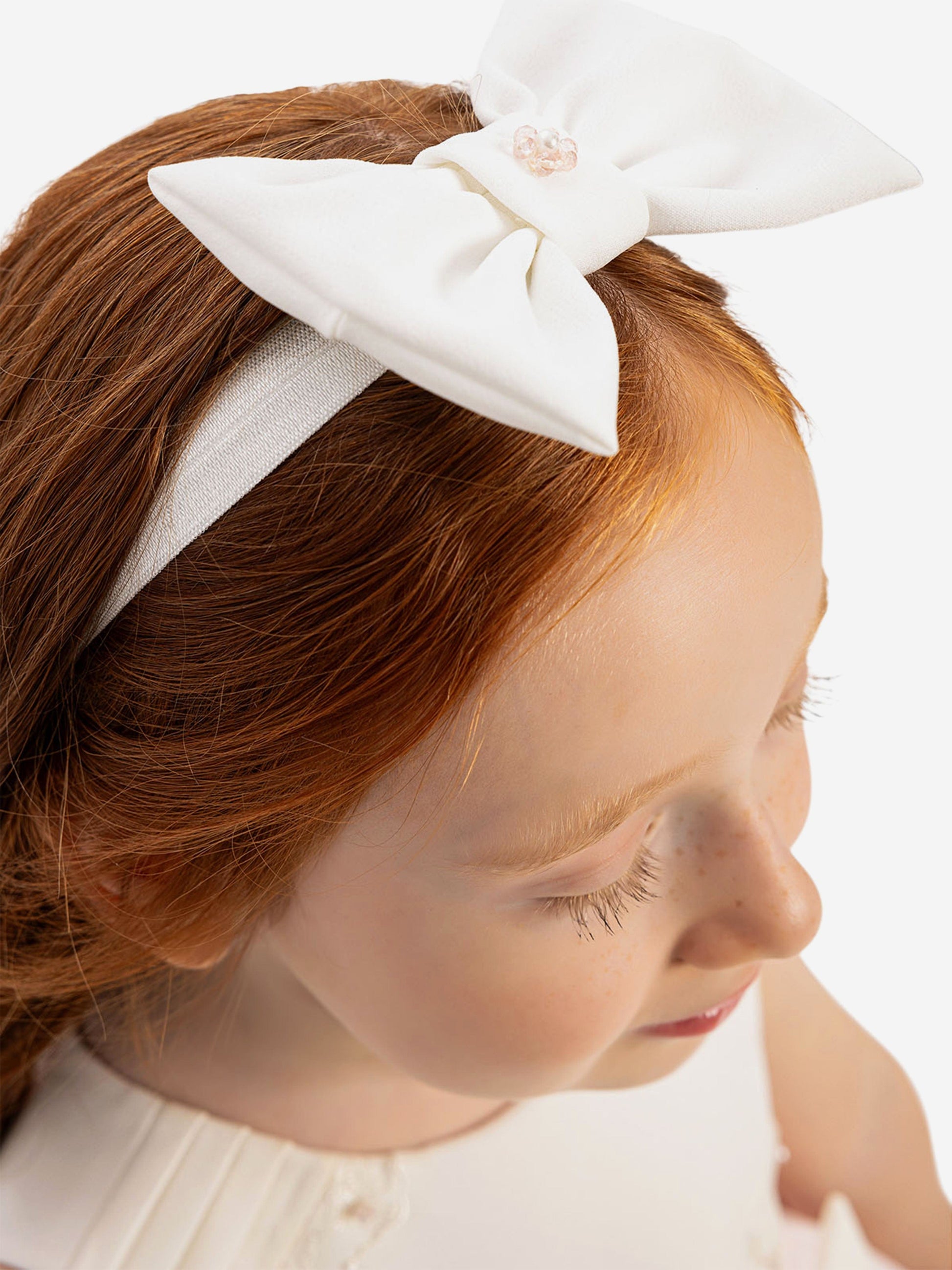White cream bow headband with pearl center