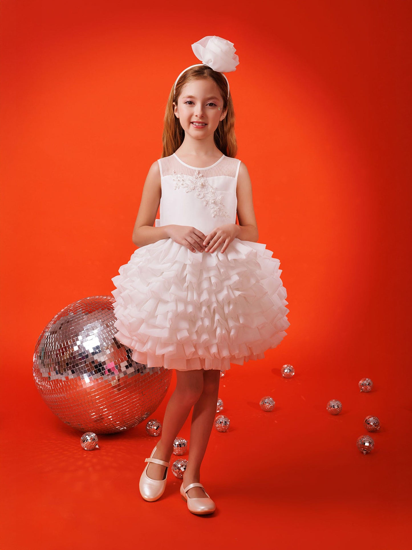 Girls white sleeveless dress with embroidered floral bodice, layered tulle skirt, and headband