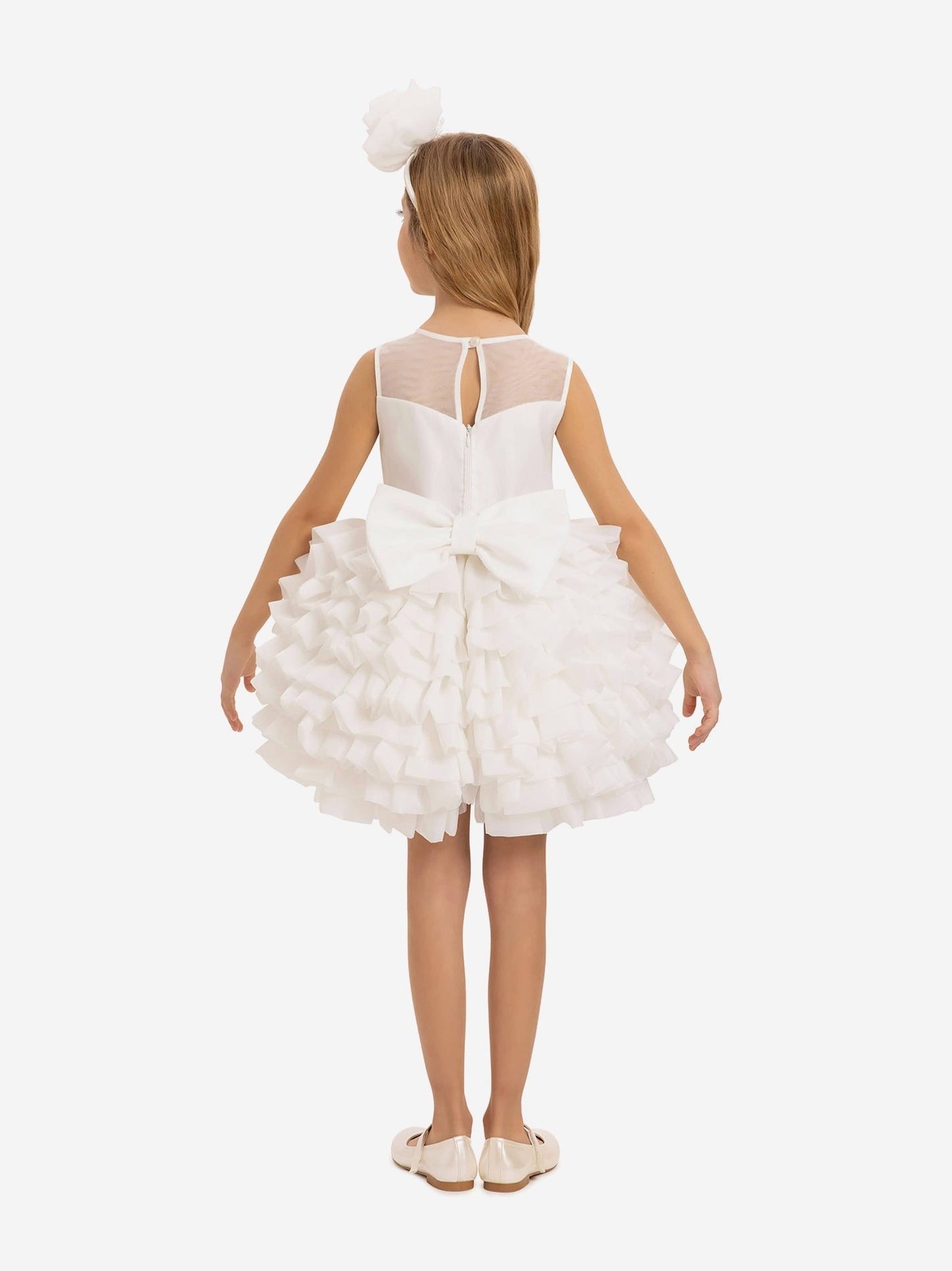 Back view girls white dress with layered tulle skirt, ribbon bow detail, plus matching headband