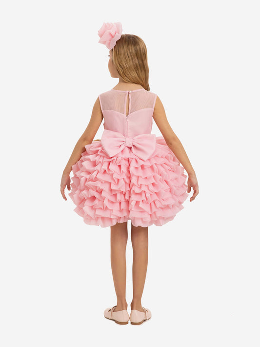 Pink girls dress, back view, bow detail and layered ruffle skirt