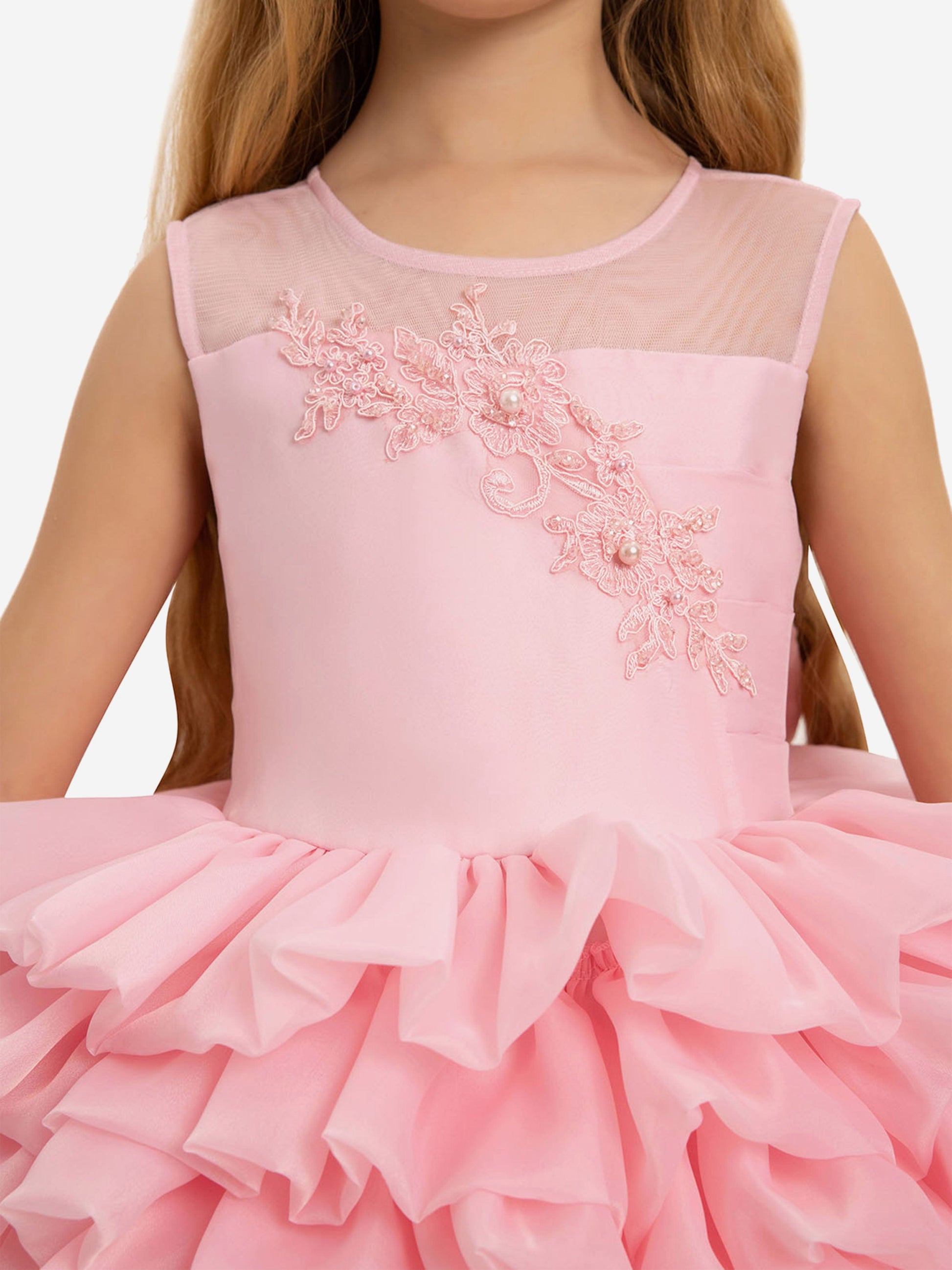 Pink sleeveless girls dress with sheer yoke and floral appliqué with pearls