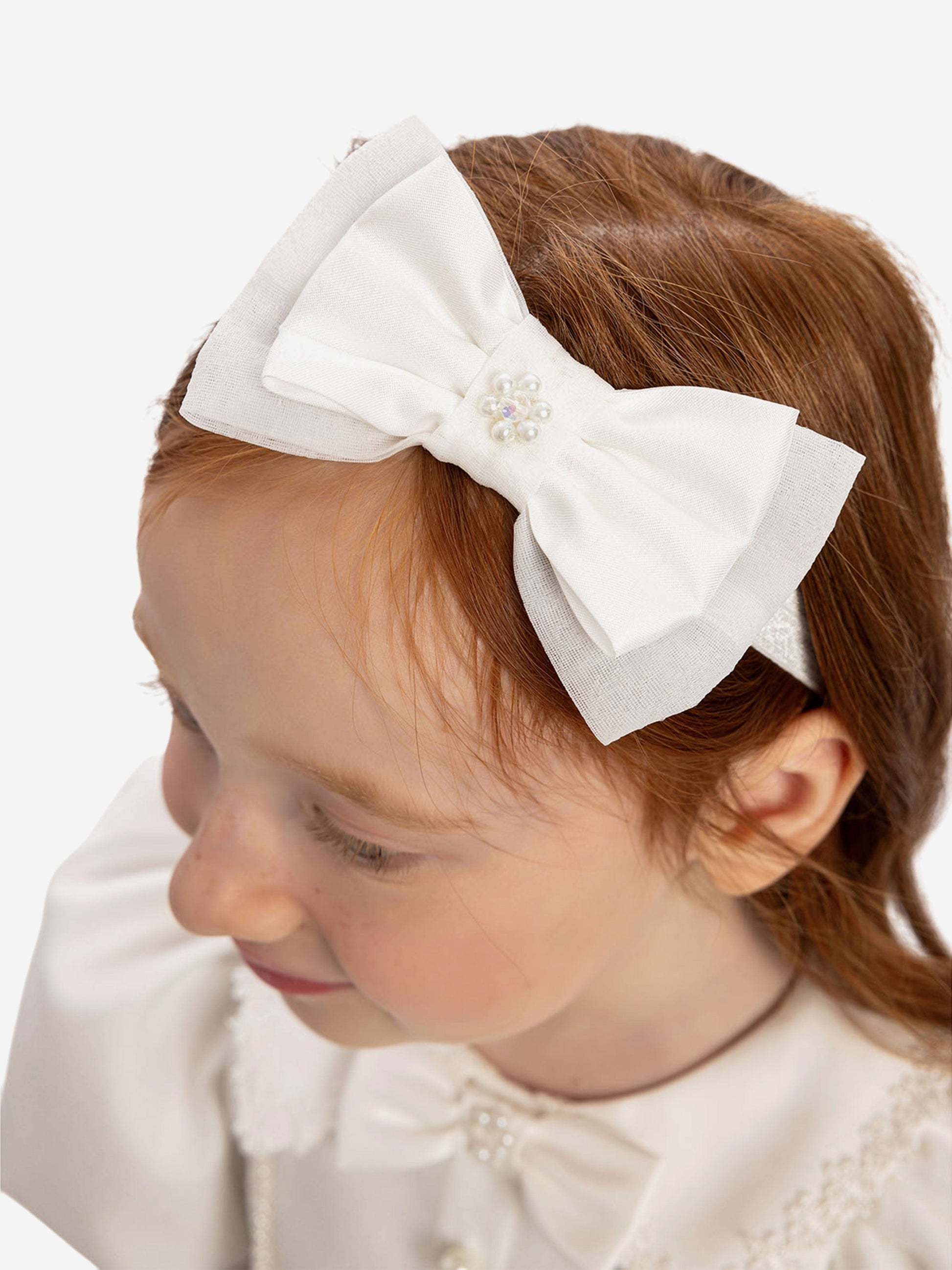 White hair bow headband with small pearl embellishment
