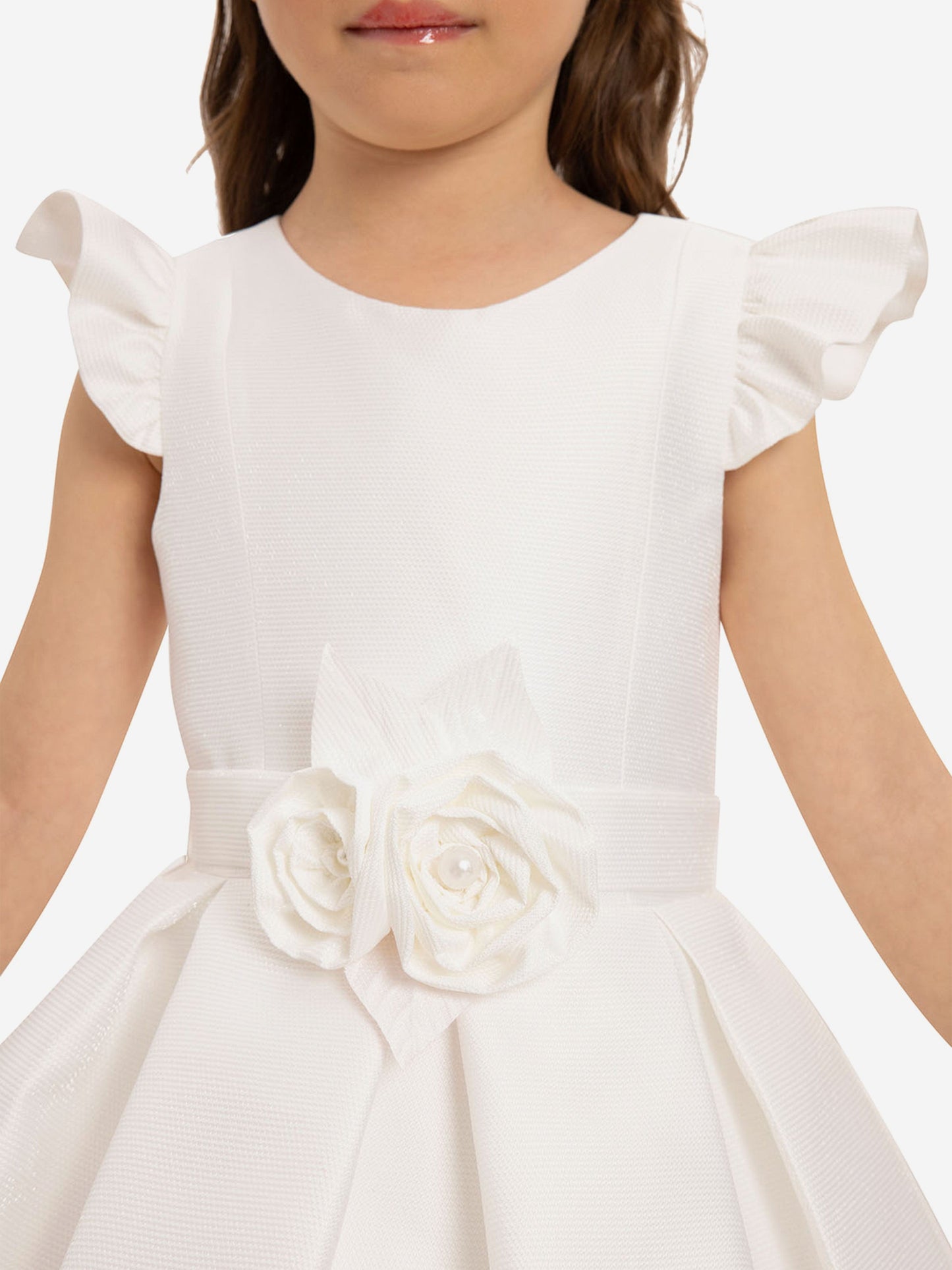 Close-up girls white dress bodice with puff sleeves and double rosette belt