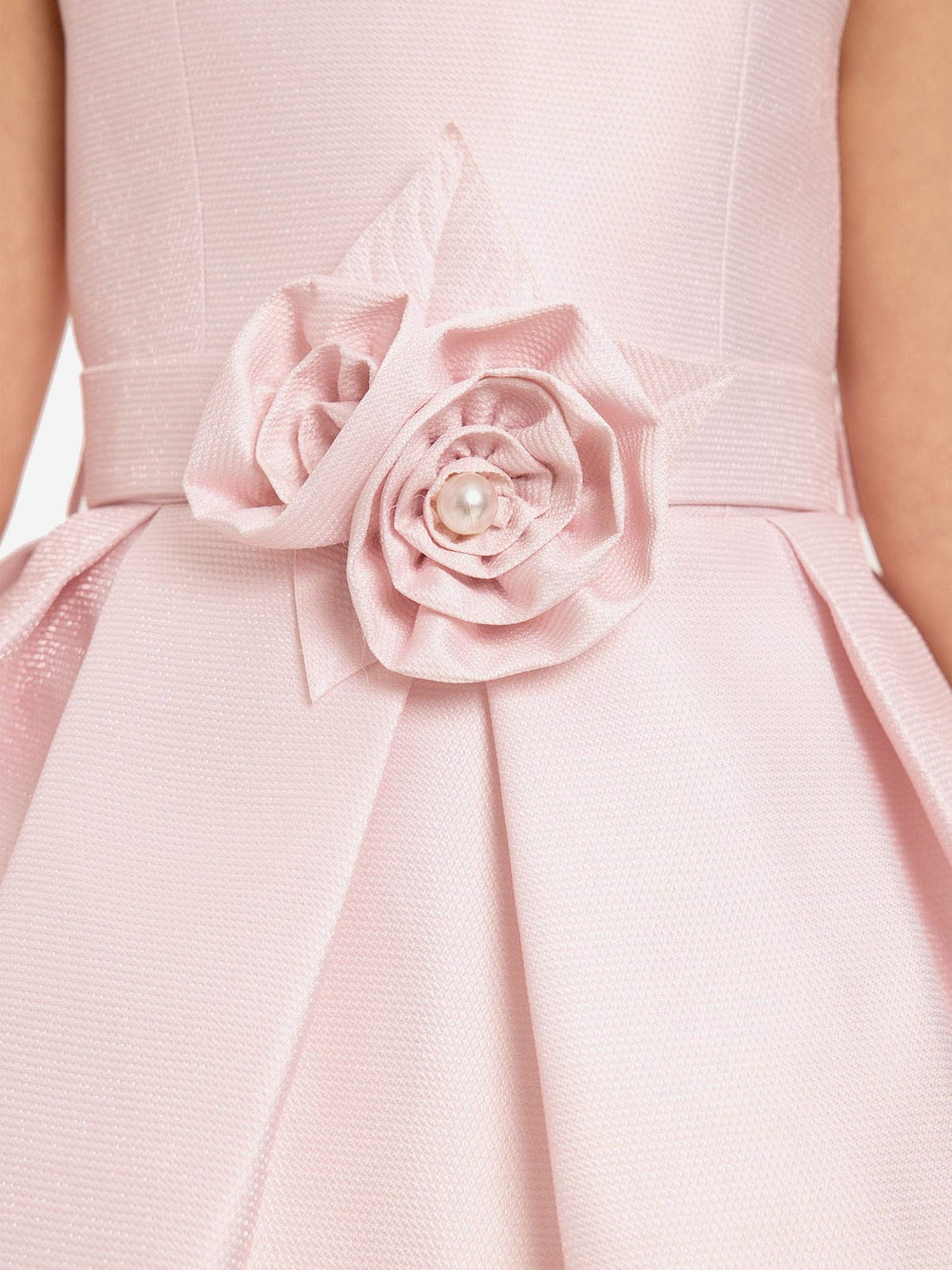 Pink dress close-up with fabric rose and faux pearl belt detail