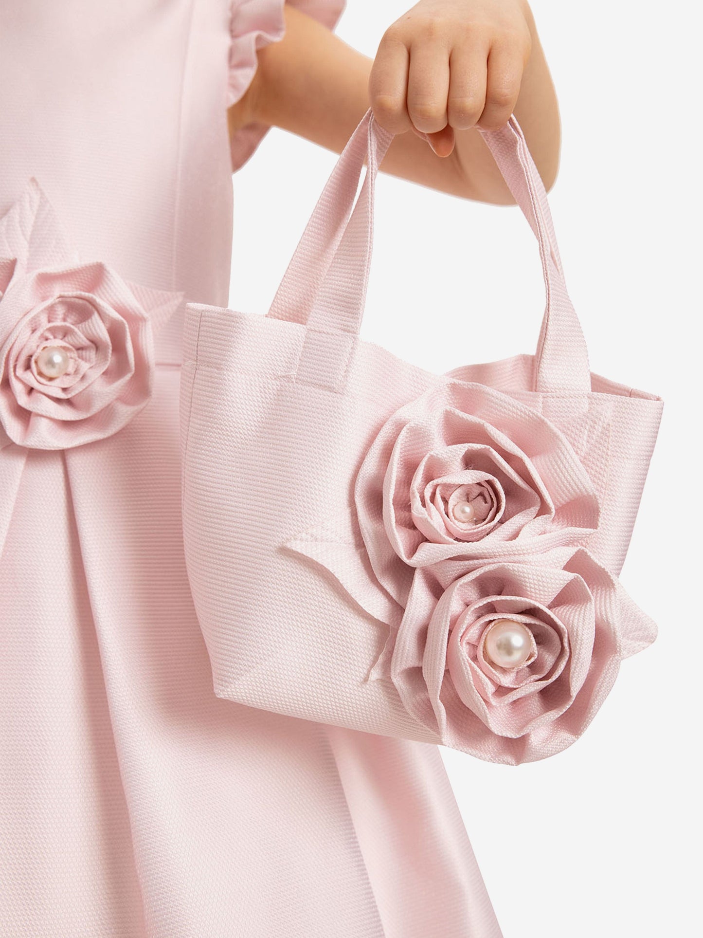Matching pink floral bag with fabric roses and pink handle