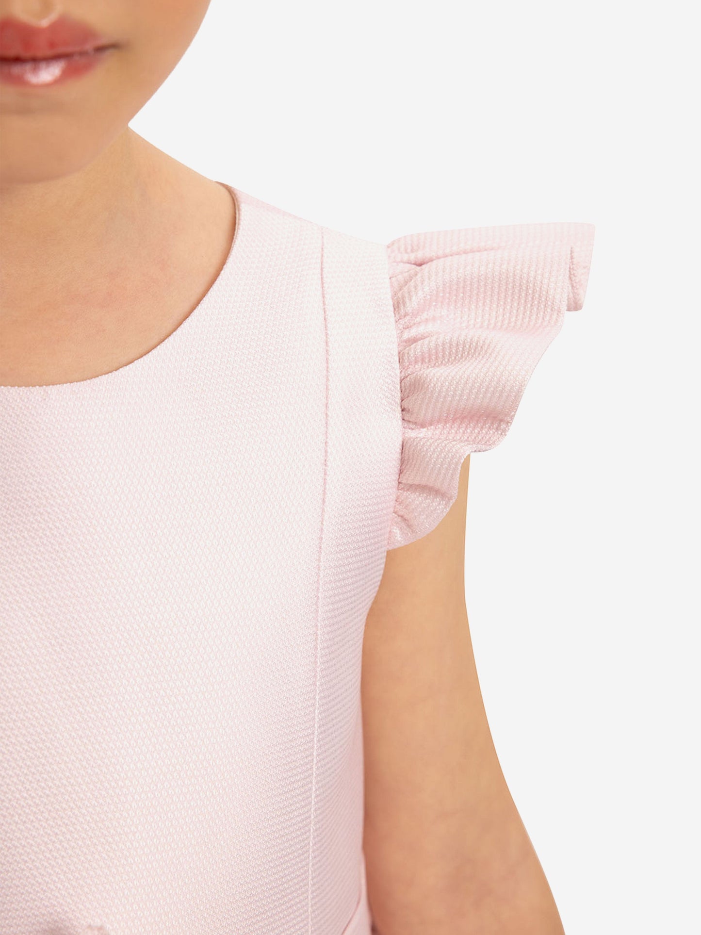 Pink girls’ dress shoulder and sleeve ruffle detail