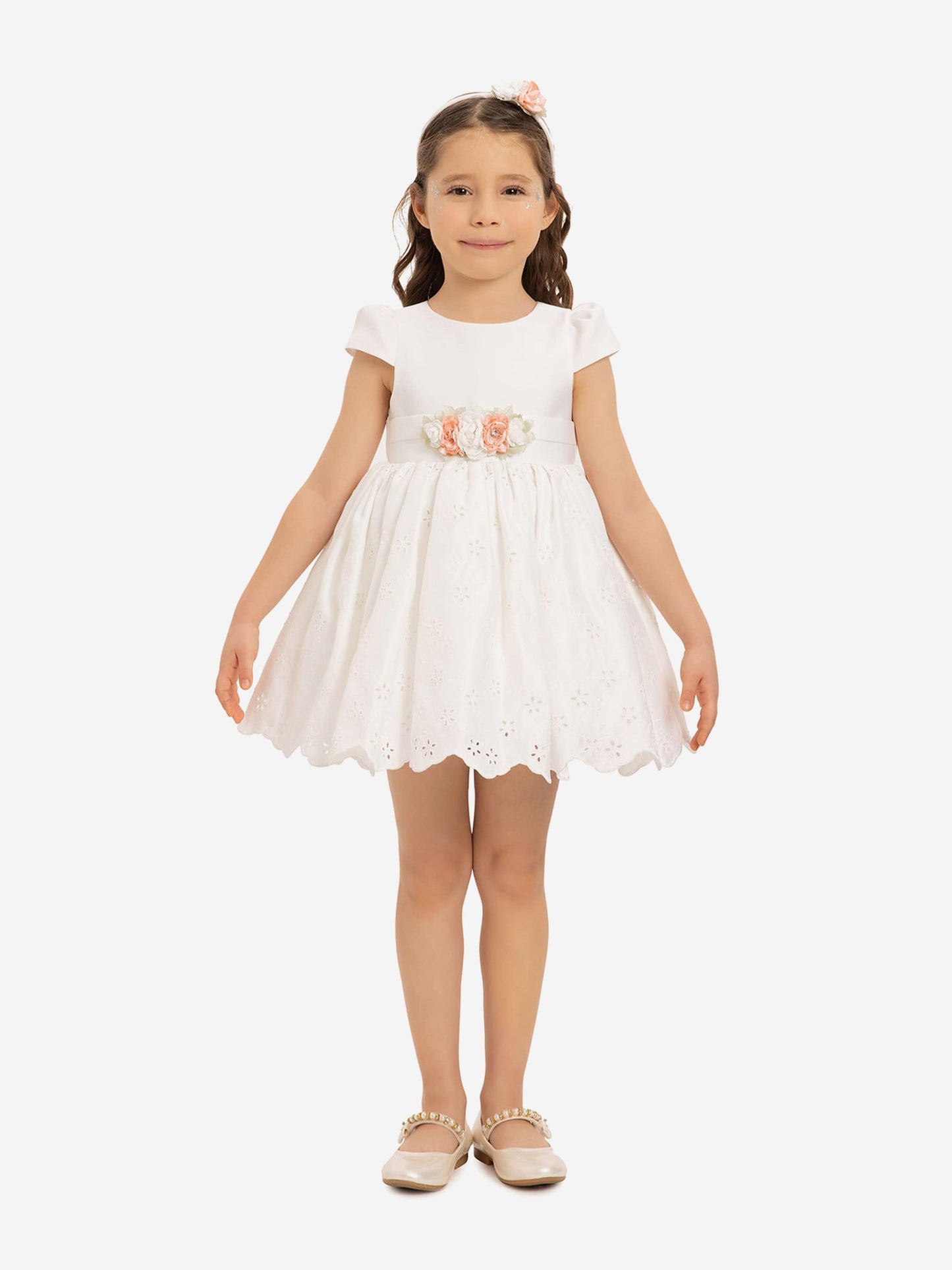White baby girls dress with peach floral waist detail and matching headband
