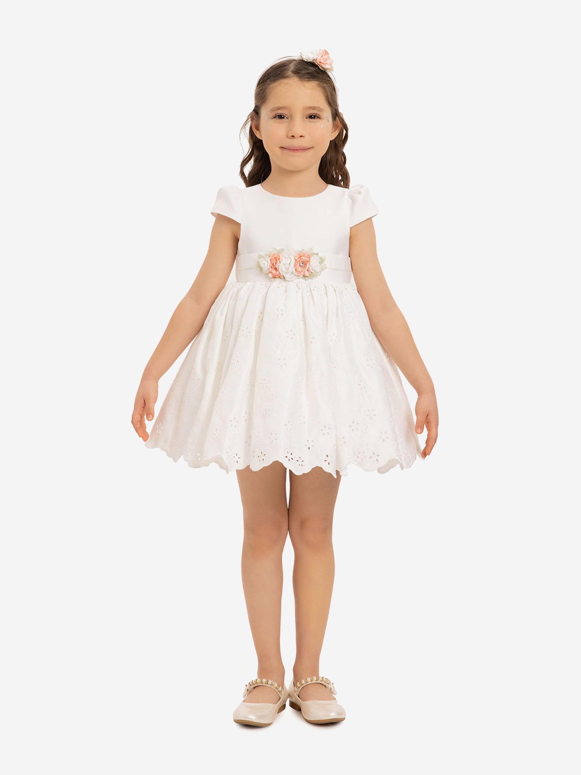 White baby girls dress with peach floral waist detail and matching headband