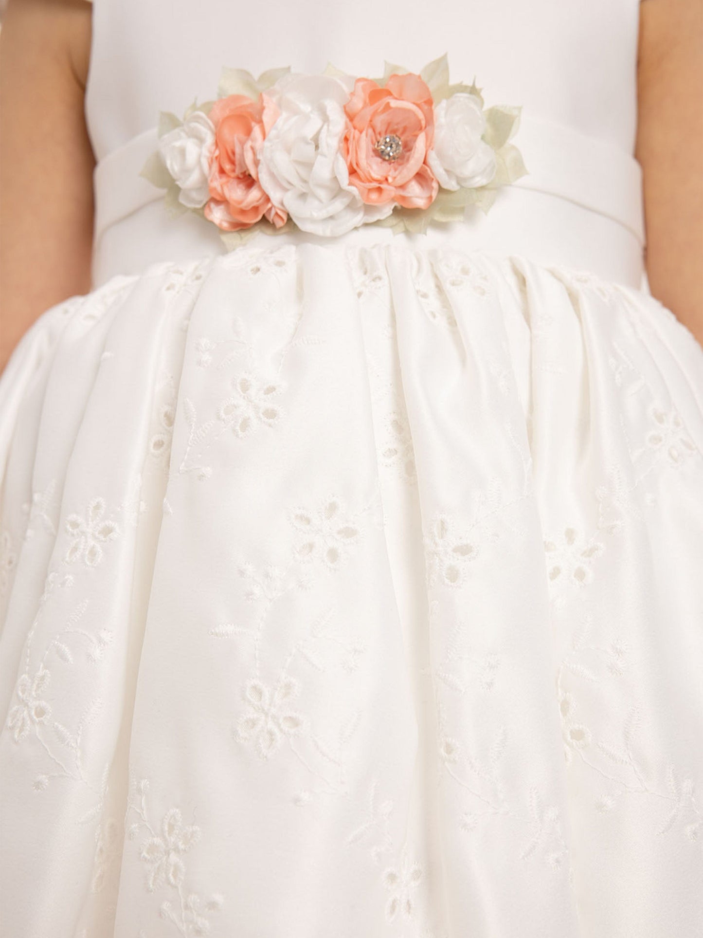 White dress bodice with layered floral applique and gathered eyelet skirt