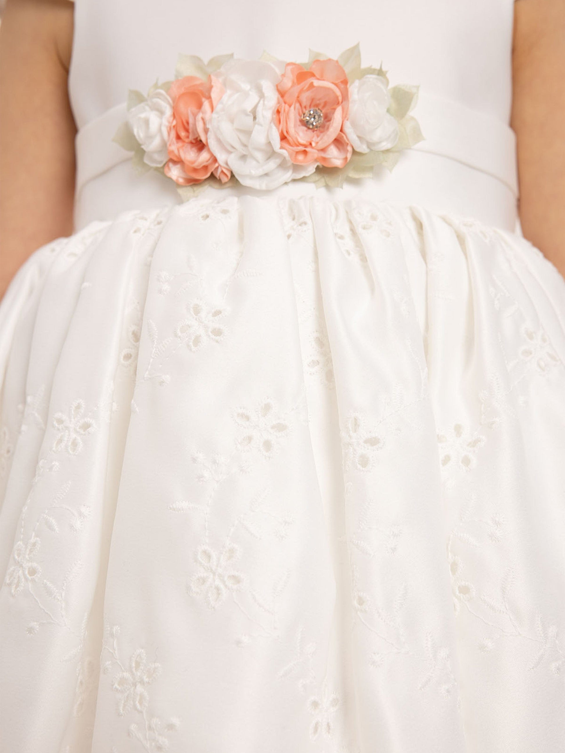 White dress bodice with layered floral applique and gathered eyelet skirt