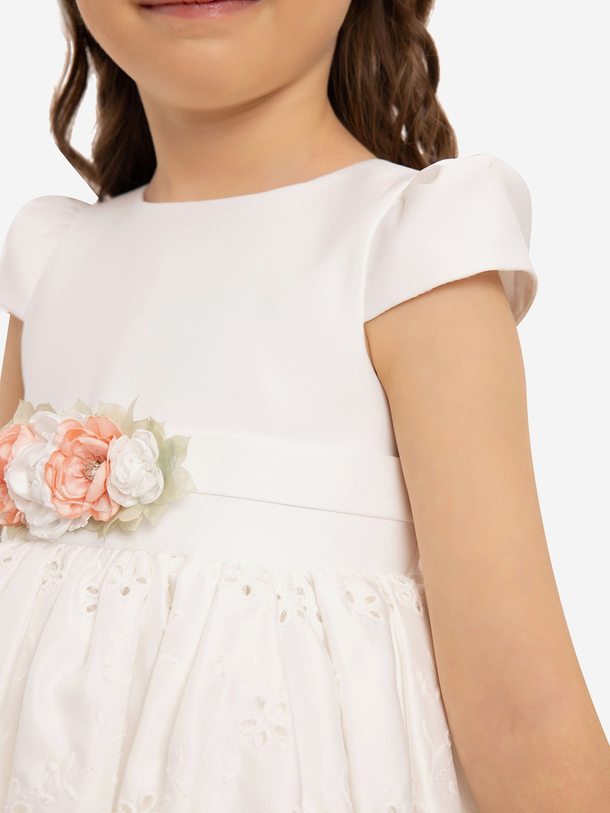 White baby girls dress with puff sleeves and peach floral waist band