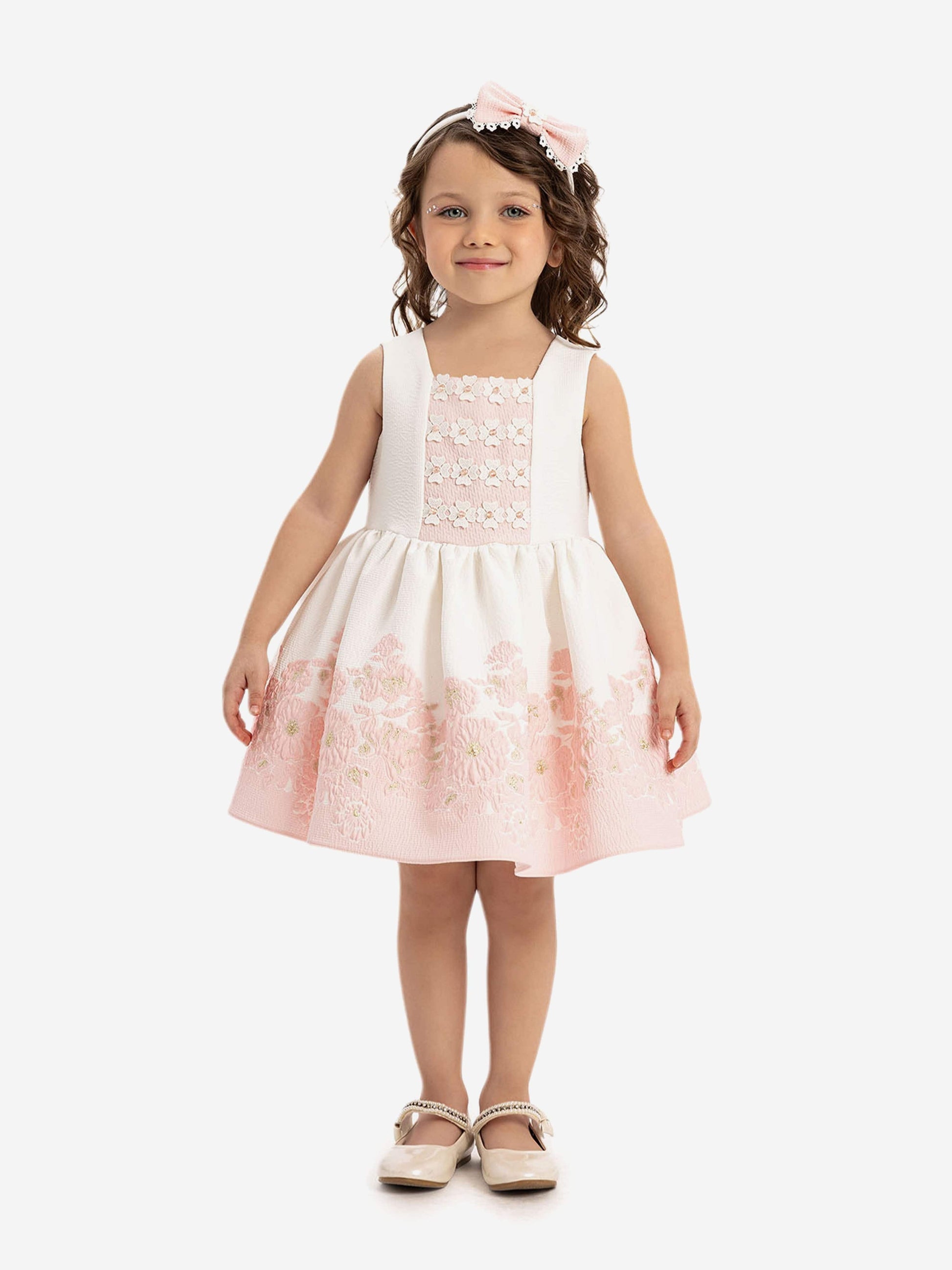 Sleeveless pink dress with white bodice, floral panel and full gathered skirt