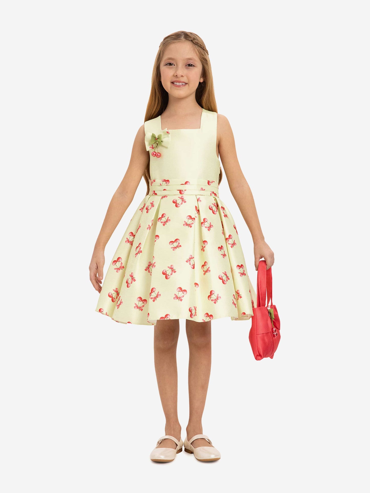 Girls pale green cherry print dress with red bow and matching cherry bag