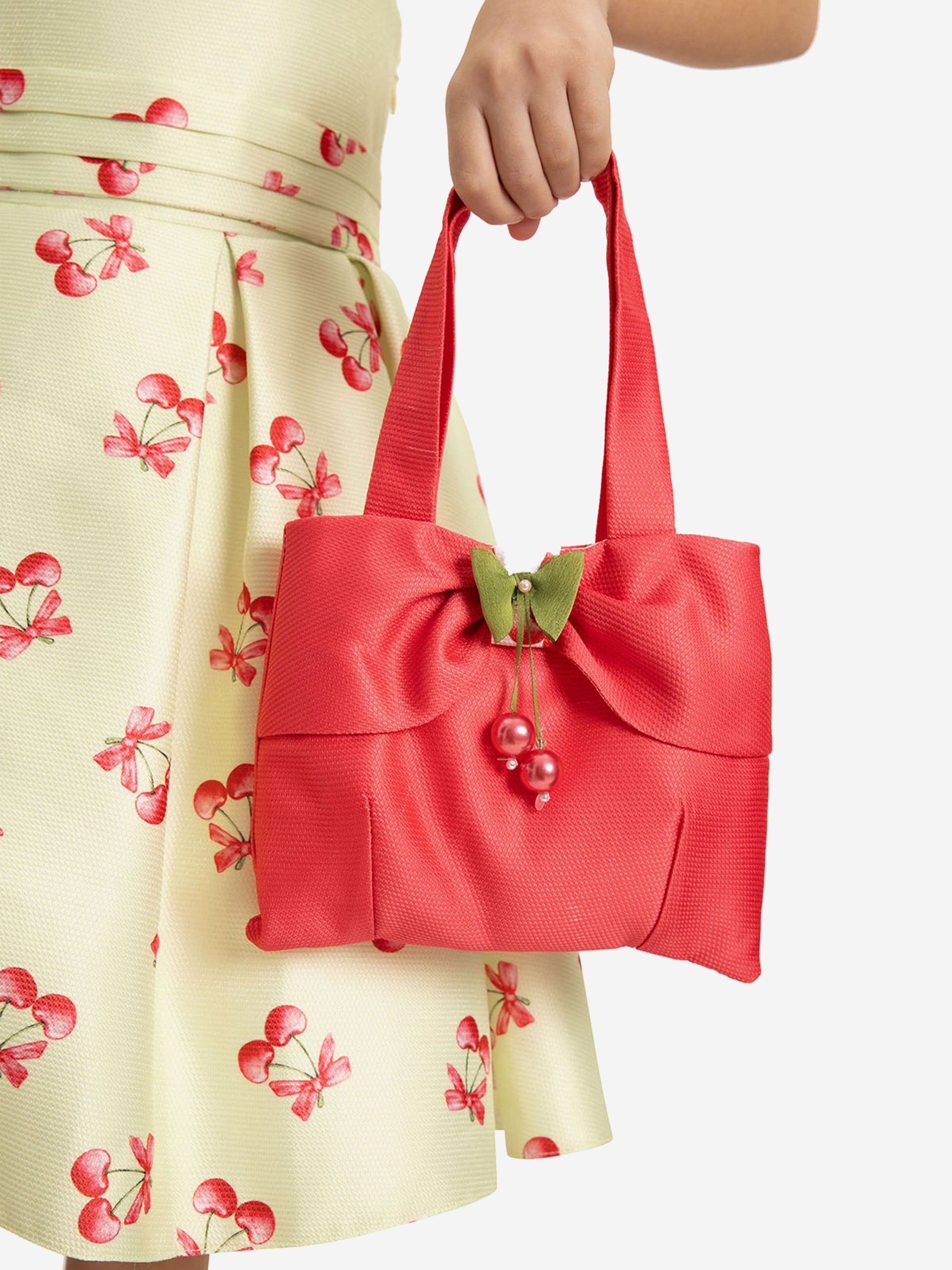 Matching red mini tote bag with bow and cherry bead charm