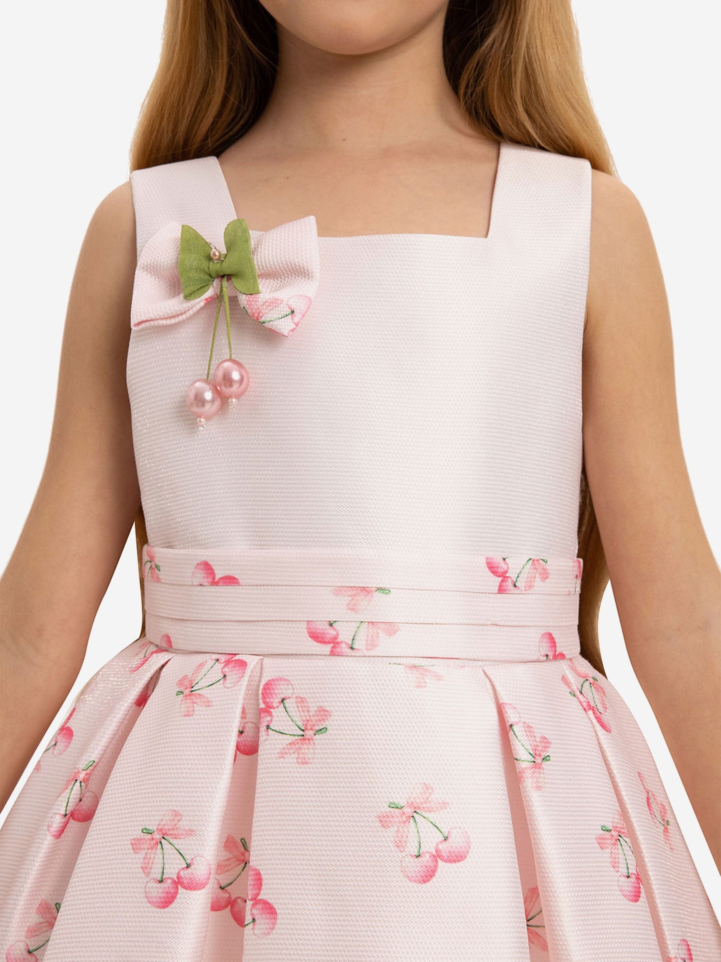 Pink dress bodice with square neckline, green bow and faux pearl cherry embellishment