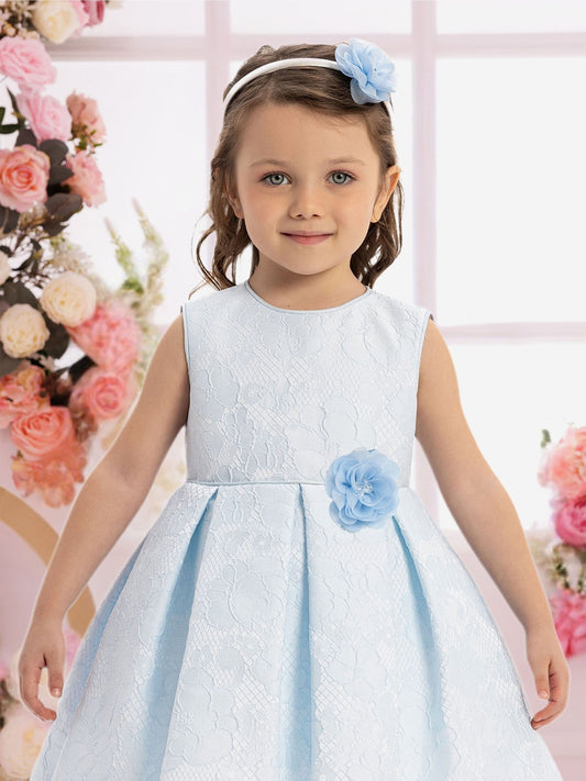 Sleeveless baby dress with blue rosette waist detail and textured white bodice