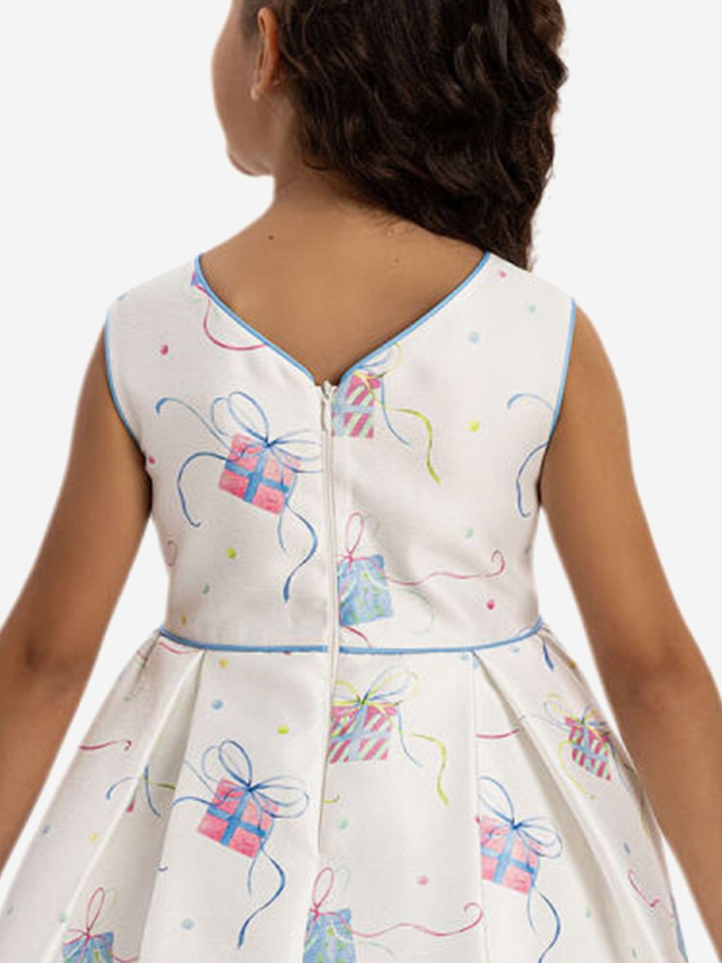 Girls’ dress back detail: keyhole opening, colorful gift print, and blue waistband trim