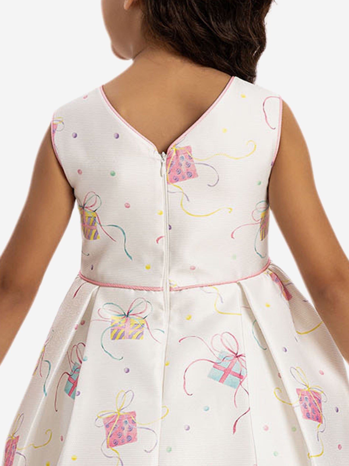 Back of girls party dress: white with gift print, keyhole detail, full twirl skirt