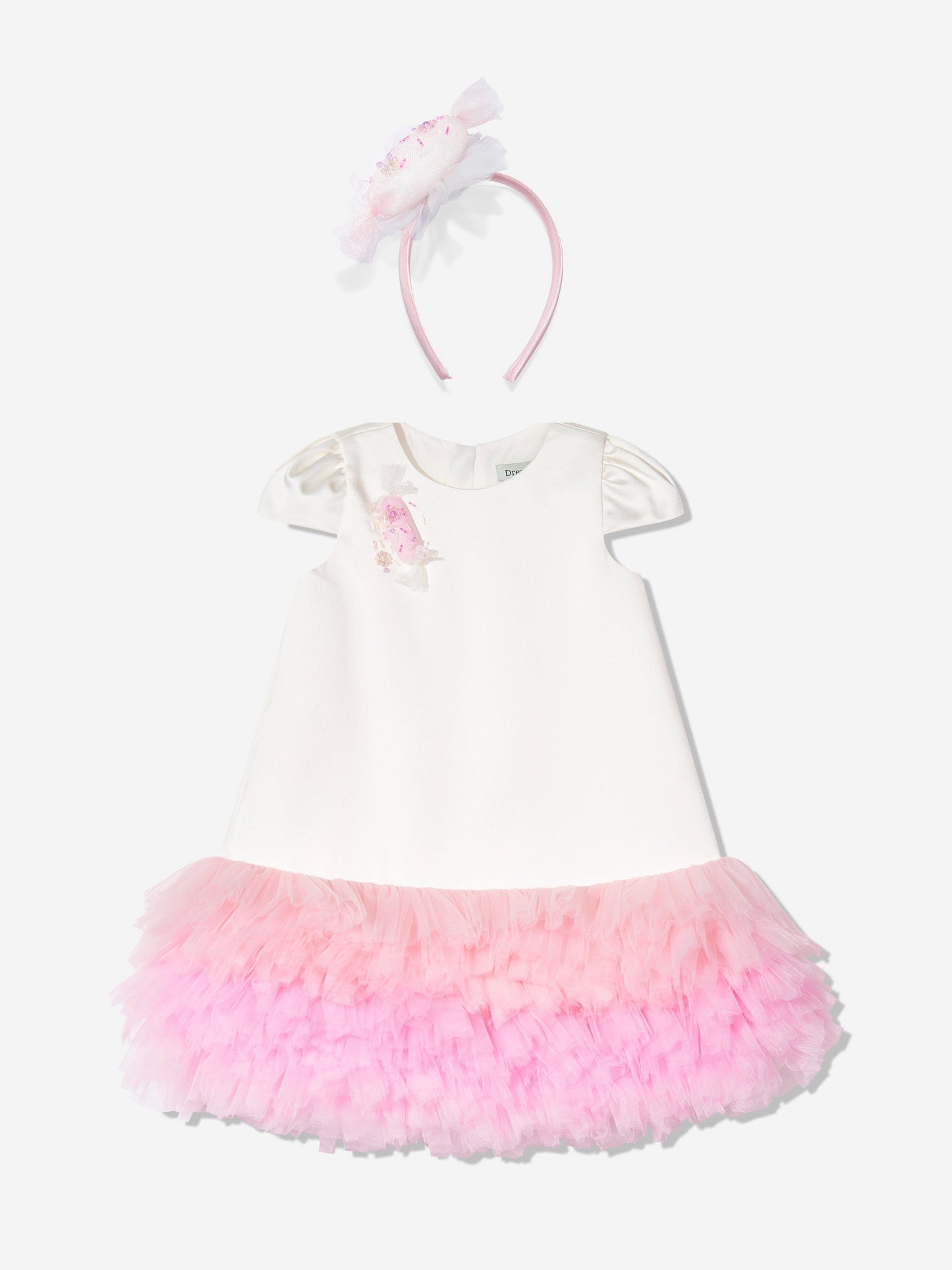 Ivory dress with puff sleeves, pink tulle skirt, and matching bow headband