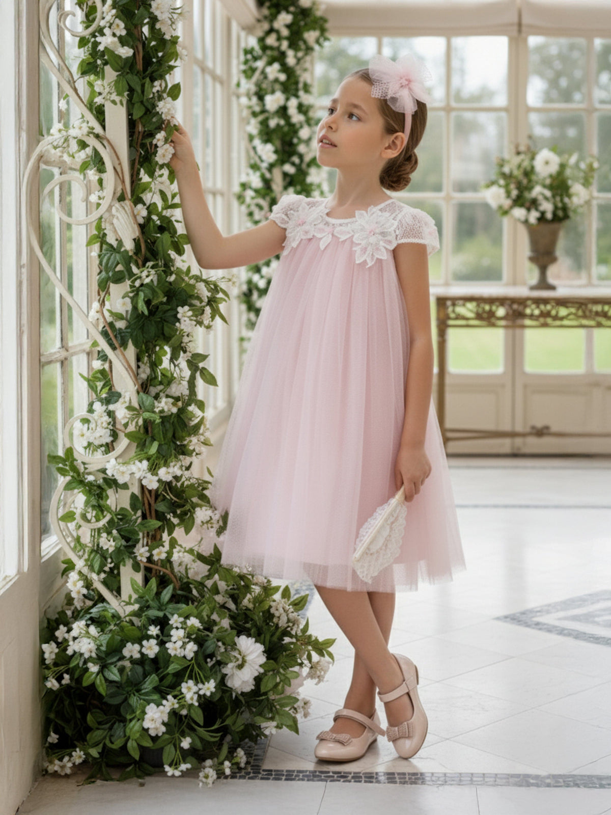 Pink occasion dress with tulle skirt, floral cap sleeves, and matching headband