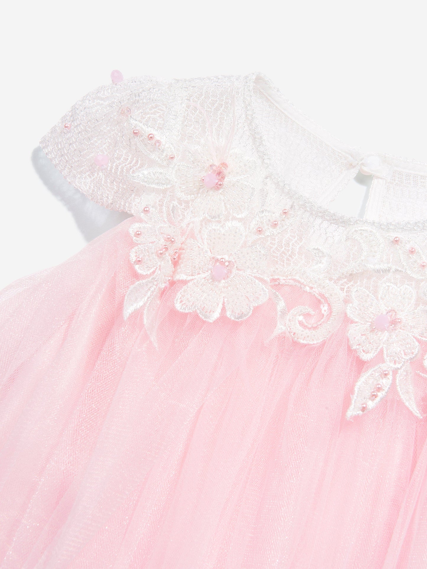 Pink tulle dress close-up of embroidered floral yoke with 3D flower details