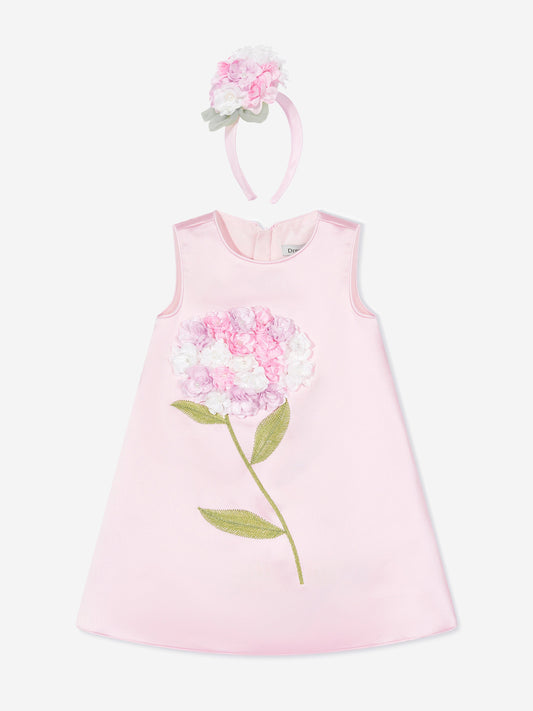 Pink sleeveless dress with large floral applique; includes pink flower headband