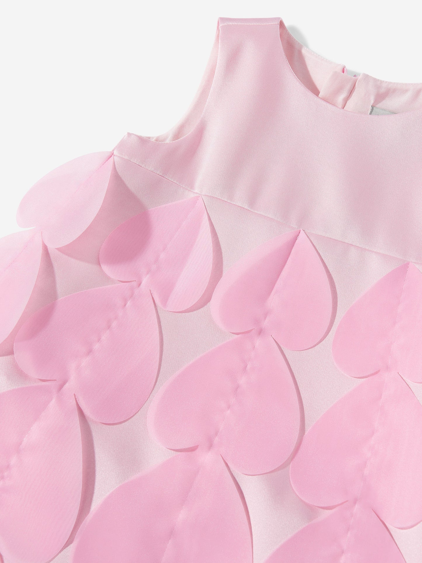 Pink heart applique fabric detail on dress bodice and cape overlay