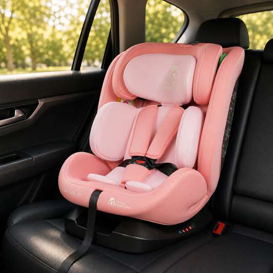 Blush rose car seat installed in vehicle, showing padded harness and head support