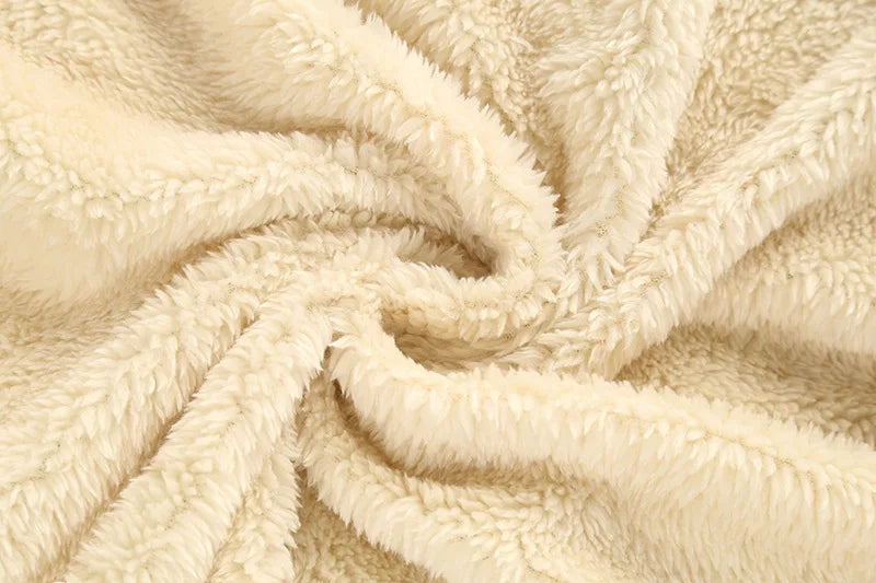 Cream plush fleece lining fabric detail for a hooded kids jacket