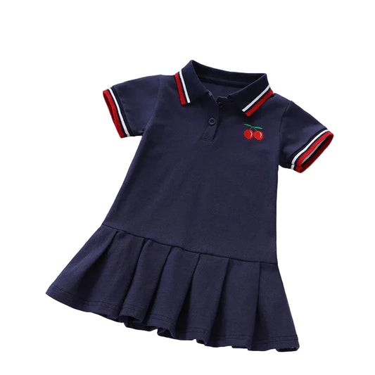 Girls navy polo dress with cherry emblem, button placket, and red striped collar