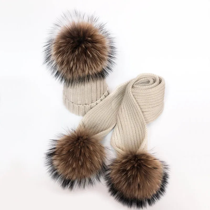 Beige ribbed knit pom-pom hat and matching scarf with faux raccoon-style pom-poms