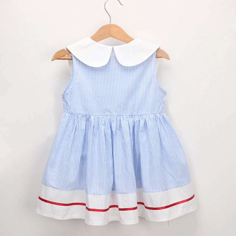 Girls blue striped summer dress back view with white Peter Pan collar and red hem trim