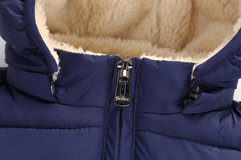 Navy blue puffer jacket close-up with front zipper and tan sherpa collar lining