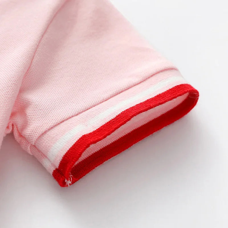 Soft pink polo dress sleeve with red-and-white striped cuff trim
