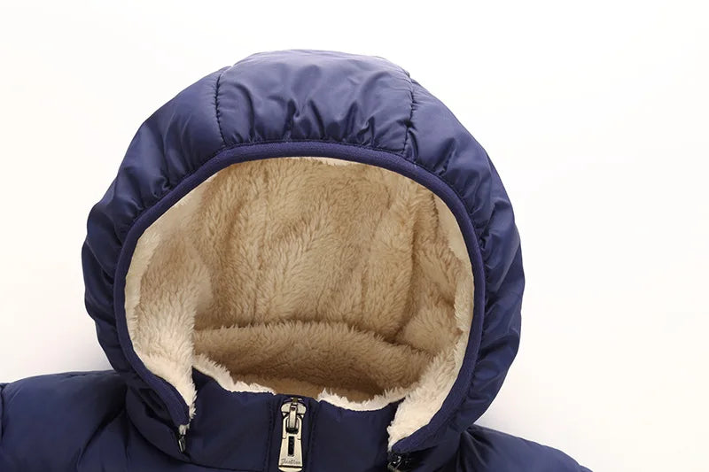Navy blue hooded puffer jacket with tan sherpa-lined hood opening