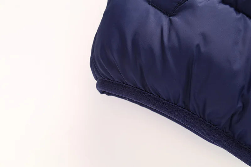 Dark blue kids puffer jacket hem and sleeve cuff, padded insulation
