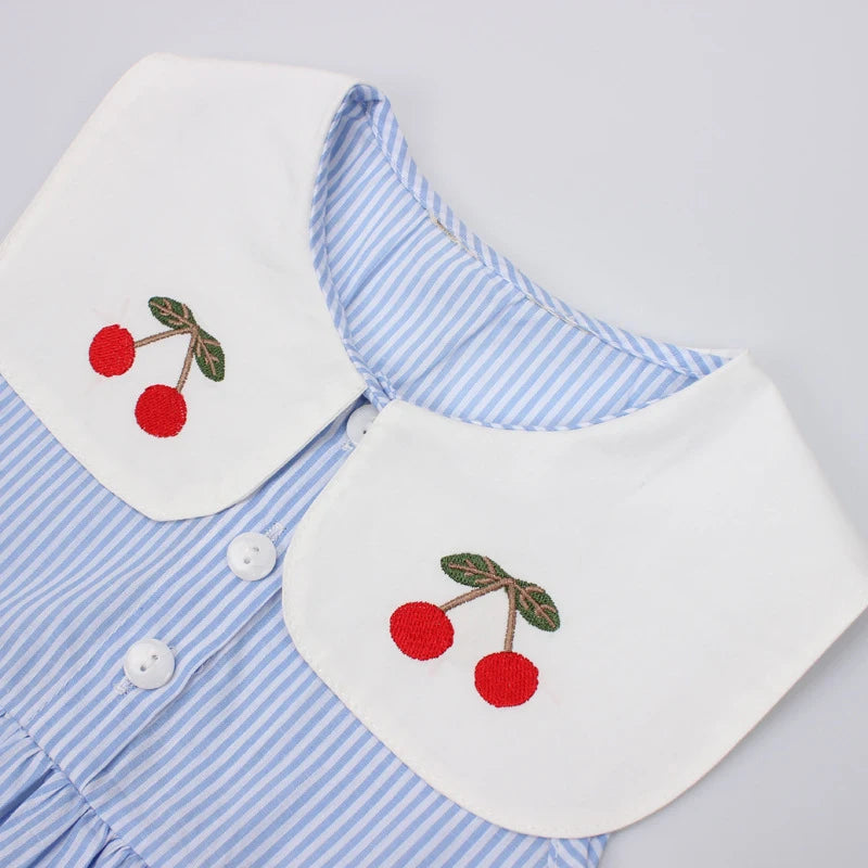 Girls blue striped summer dress close-up: white collar with cherry embroidery