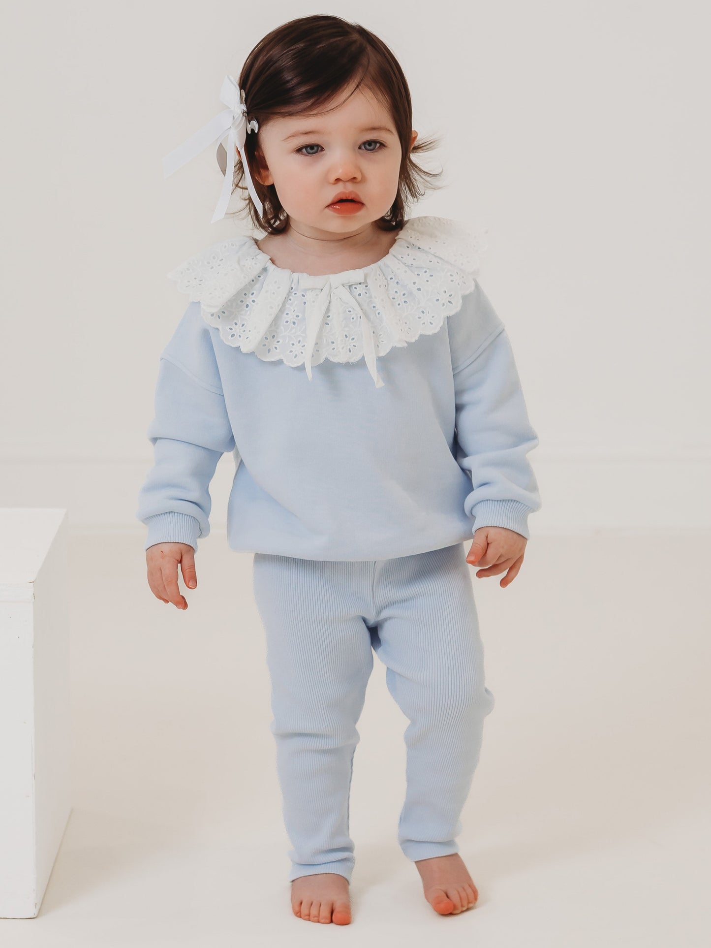 Light-blue kids top and ribbed leggings set with white lace frill collar