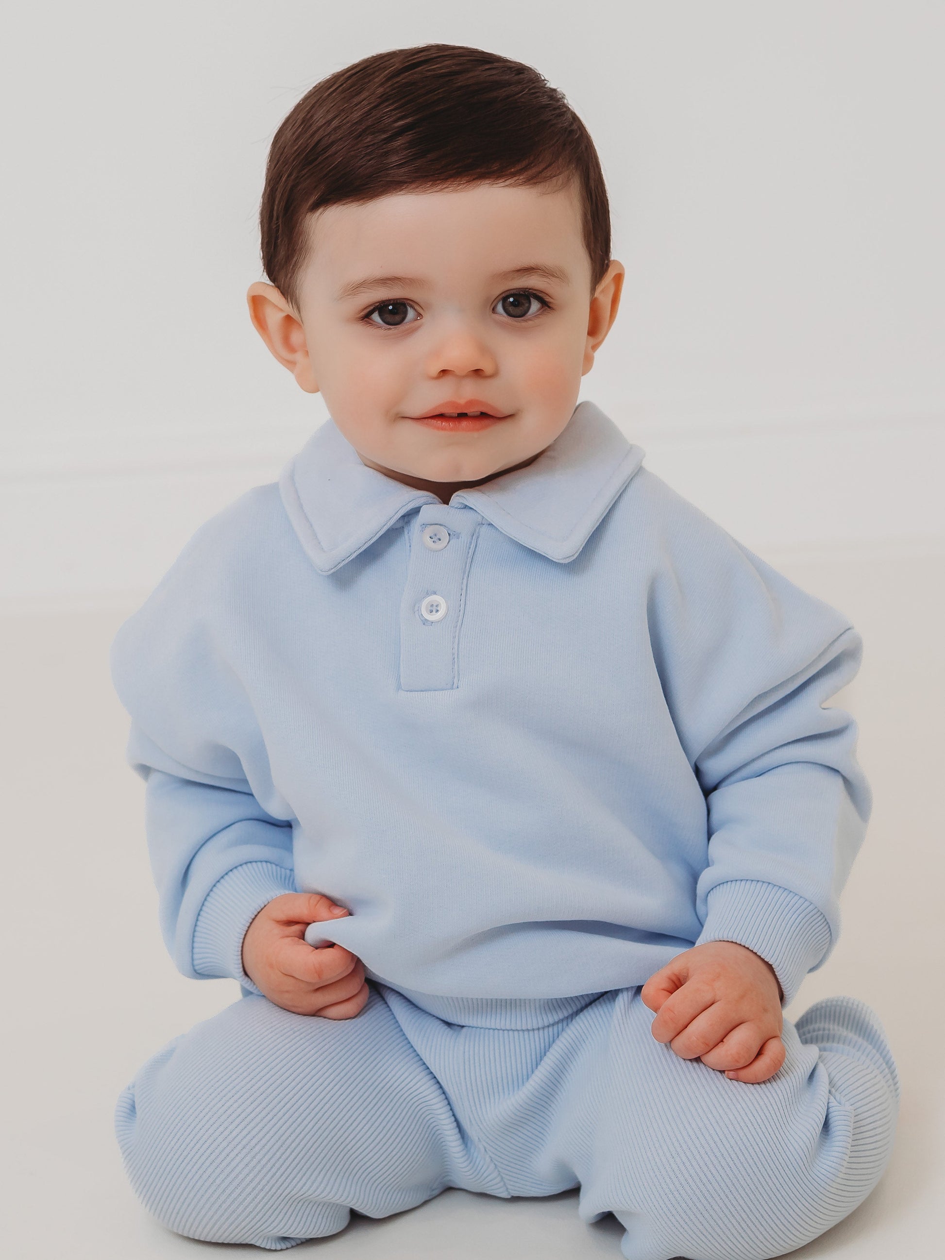 Light blue polo collar top and ribbed leggings set, button placket and cuffs