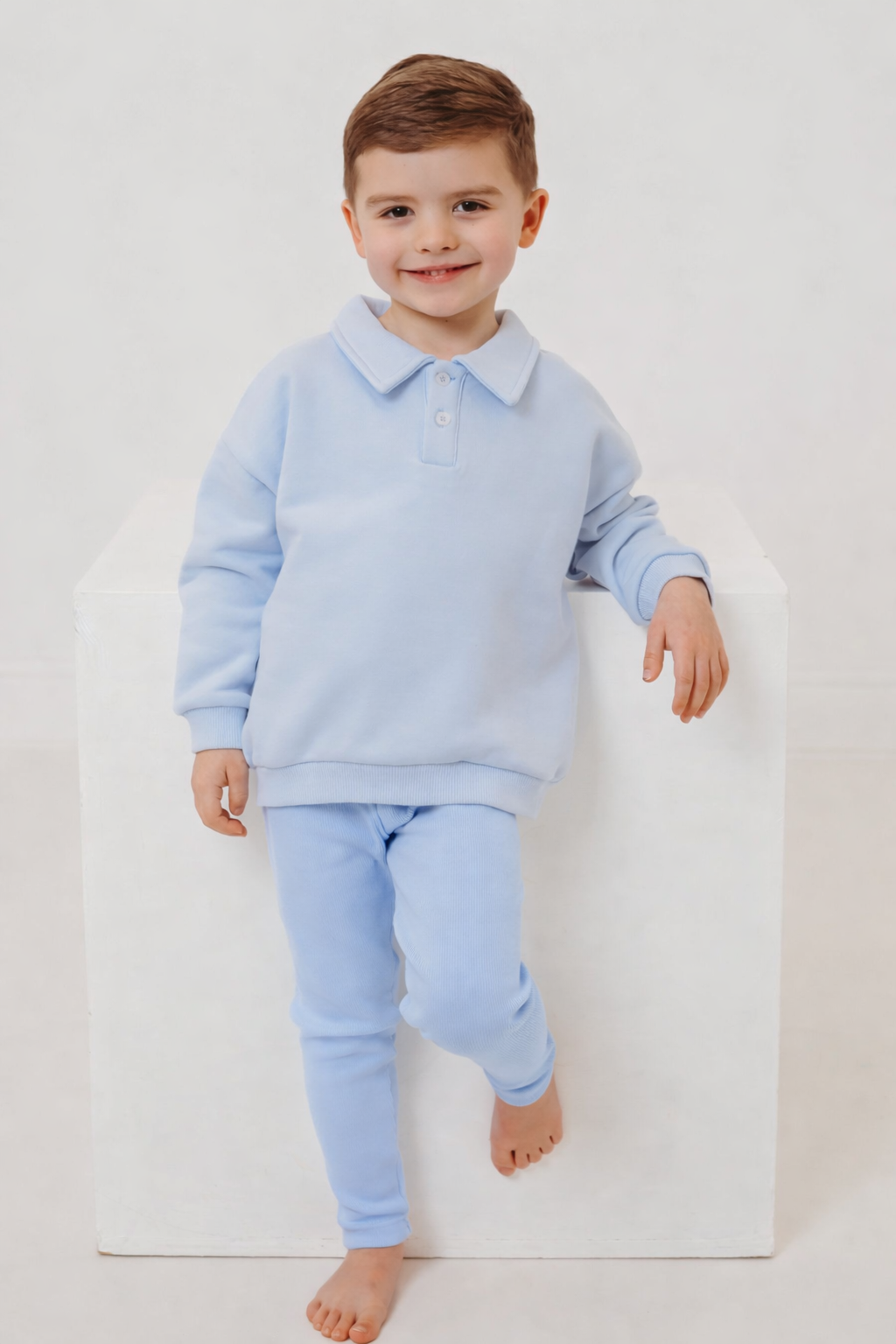 Light blue polo collar top and ribbed leggings set, toddler standing