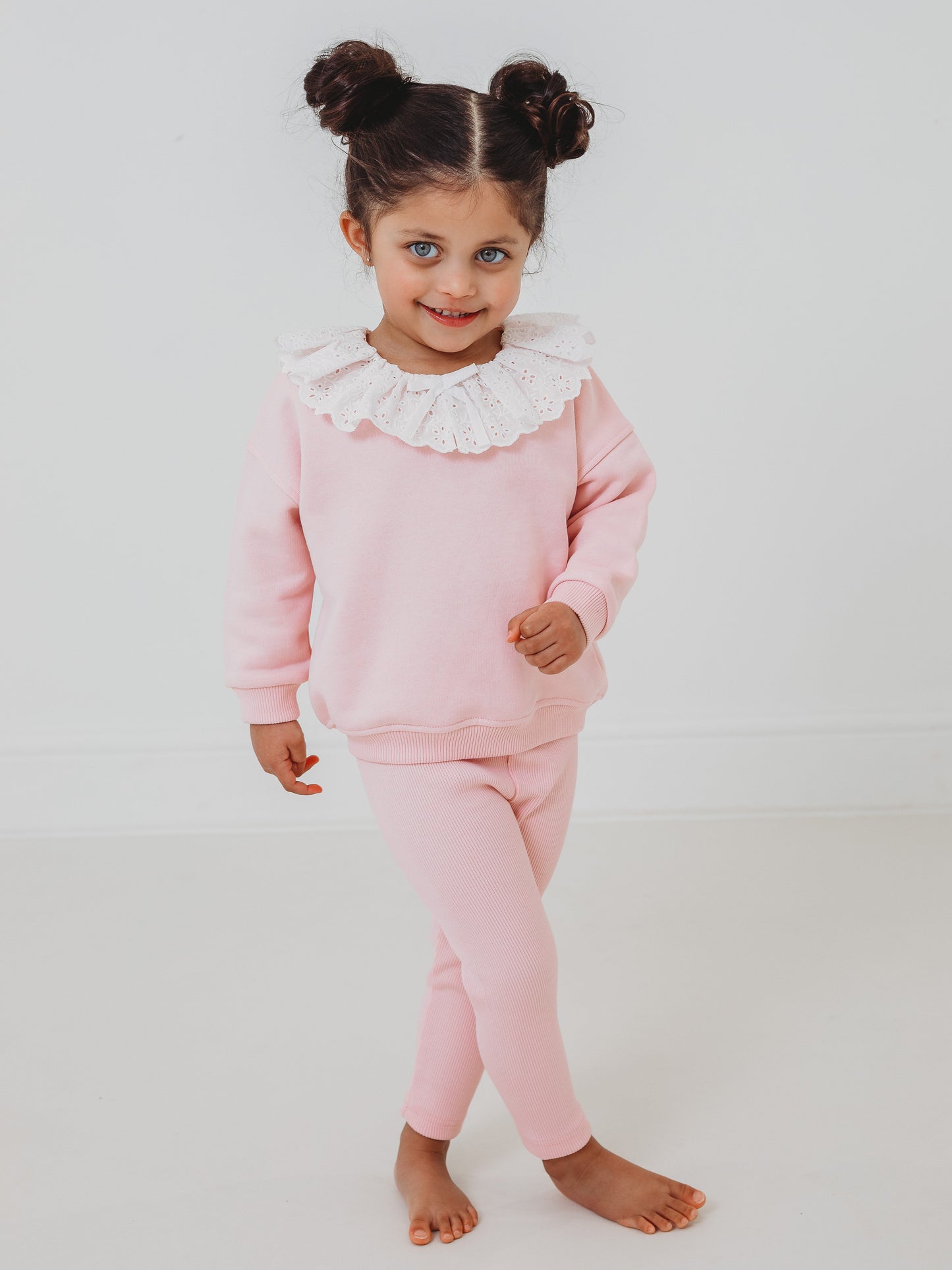 Pink top with white anglaise frill collar and matching ribbed leggings, full body