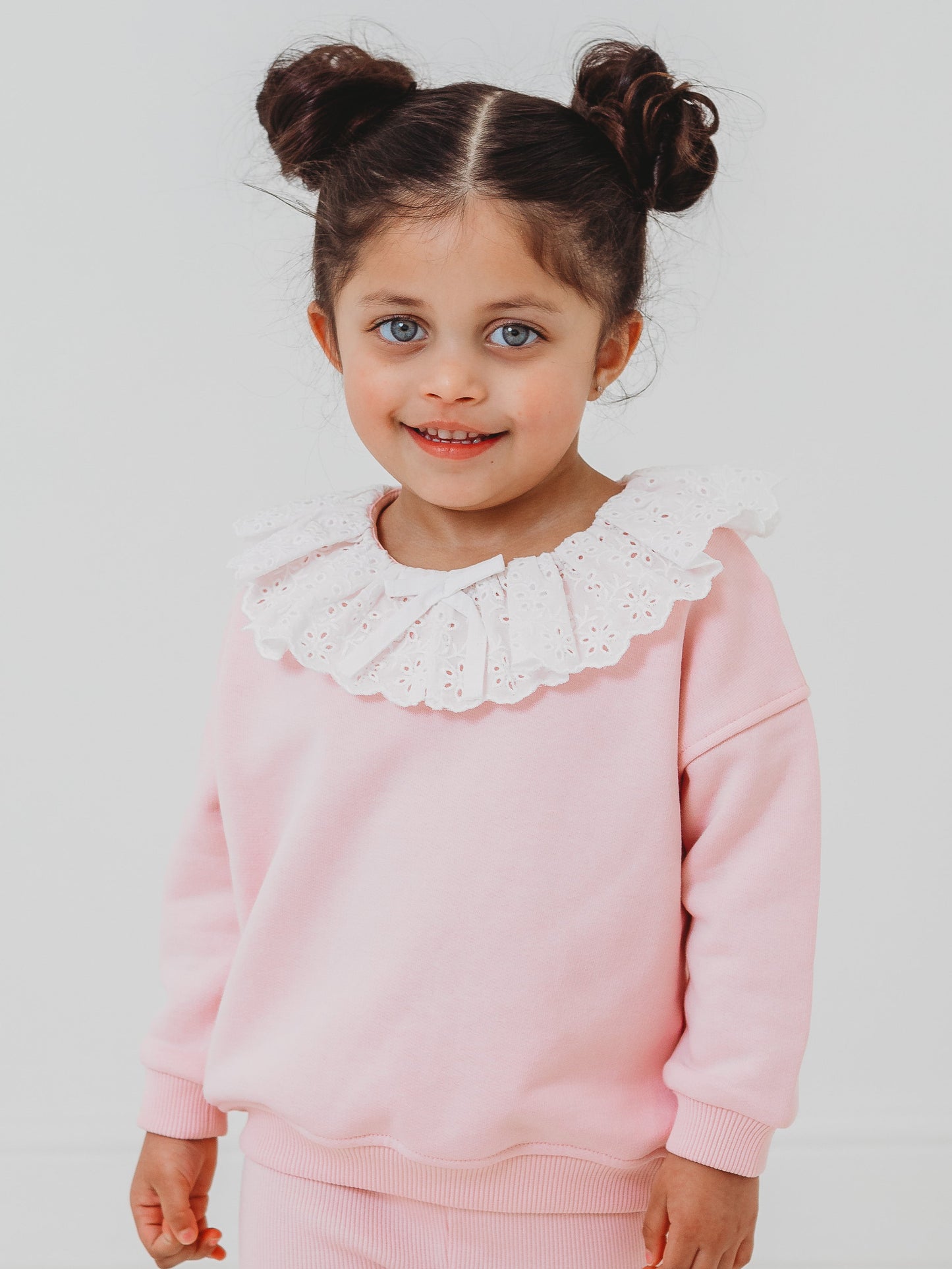 Pink frill collar anglaise top with long sleeves and ribbed leggings, front view