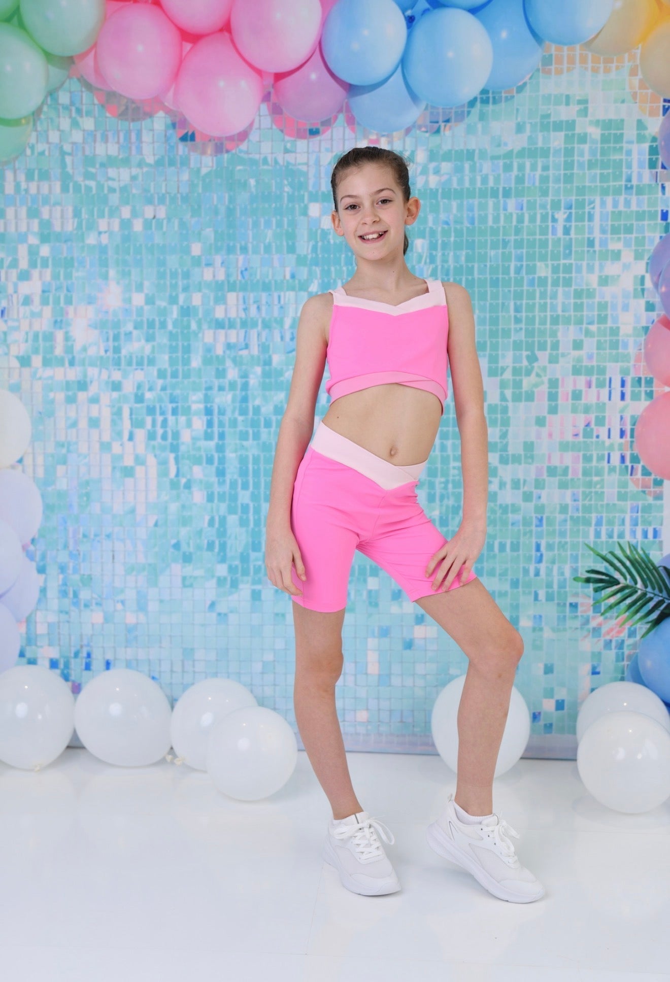Kids bright pink crop top and cycle shorts set with V-neck front and white trim