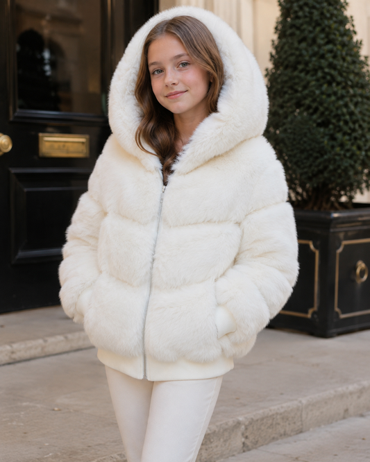 Ivory faux fur hooded bomber jacket worn with zip front and side pockets