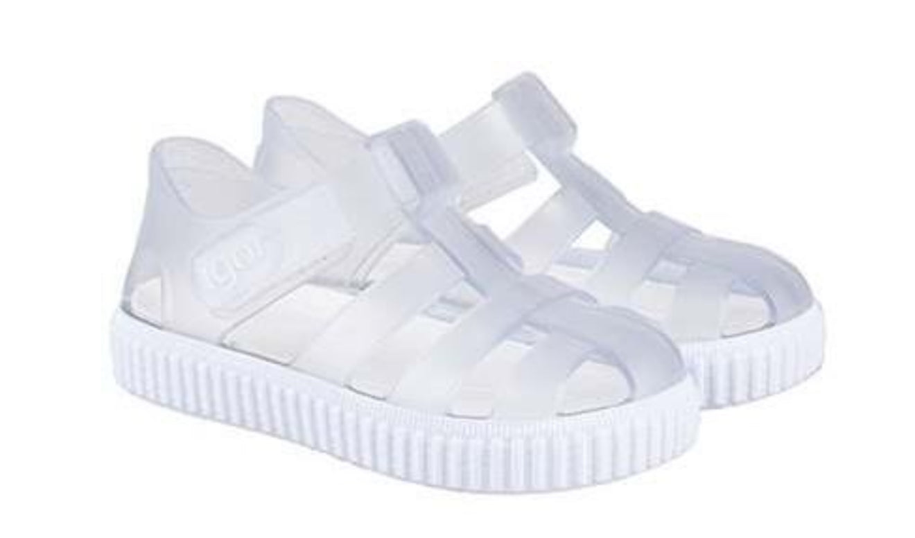 Clear jellie shoe in white with molded straps and ridged rubber sole